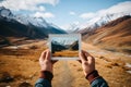 Hand holding a instant snapshot of a mountain landscape Royalty Free Stock Photo