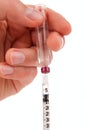 Hand holding insulin syringe Royalty Free Stock Photo