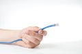 Hand holding internet cable. Royalty Free Stock Photo