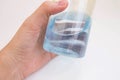 Hand holding an Isopropyl alcohol bottle Royalty Free Stock Photo