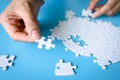 Hand holding a jigsaw puzzle. jigsaw puzzle Solve problems working together Organize team building connection plan Choosing the