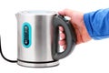 Hand holding a kettle