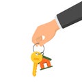 Hand holding a key and a fob. Concept of buying or renting a new house or apartment