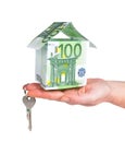 Hand holding key and house made out of euro money. Royalty Free Stock Photo