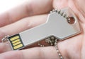 Hand holding a key shaped USB drive Royalty Free Stock Photo