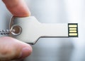 Hand holding a key shaped USB drive Royalty Free Stock Photo