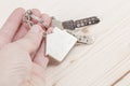 Hand holding keys with house shaped keyring Royalty Free Stock Photo
