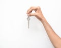 Hand holding keys isolated on a white background Royalty Free Stock Photo