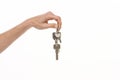 Hand holding keys isolated on white background Royalty Free Stock Photo