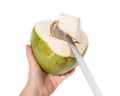 Hand holding knife with coconut peeling on white background