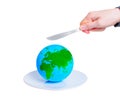 Knife in Hand Close to a Globe on Plate