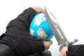 Hand holding knife ready to stab globe world map Royalty Free Stock Photo