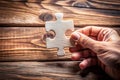 Hand with Missing Jigsaw Puzzle Piece - Business Concept Image for Completing the Final Puzzle Piece