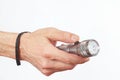 Hand holding a led torch on white background Royalty Free Stock Photo