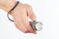 Hand holding a led torchlight on white background