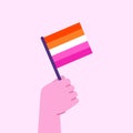 Hand holding lesbian flag. Pride month concept