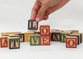 Hand holding the letter, which forms the word `love`, VERSION 1 Royalty Free Stock Photo