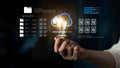 Hand Holding Light Bulb with Cloud Storage and Data Loading Concept in Modern Digital Workspace Environment Ledger Royalty Free Stock Photo