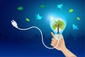 Hand holding light bulb growing green tree with flying bird. Sustainable environment to save energy and nature protection. Royalty Free Stock Photo