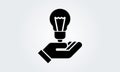 Hand holding light bulb. Icon. Innovation idea concept. Tip logo design. Flat style vector. Black, white illustration Royalty Free Stock Photo