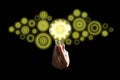 Hand holding light bulb and Innovation gears connection icon inside. Idea and inspiration on black background Royalty Free Stock Photo