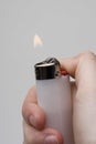 Hand holding a lighter Royalty Free Stock Photo
