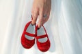 Hand Holding Little Red Shoes Royalty Free Stock Photo