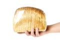 Hand holding a loaf of sliced bread. Close up. Isolated on white background Royalty Free Stock Photo