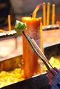 Hand holding lotus flower and incense sticks. Traditional Thailand buddhist concept