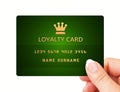 Hand holding loyalty card isolated over white