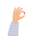 Hand holding the magic pill. Vector illustration. Royalty Free Stock Photo