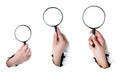 Hand holding a magnifying glass