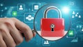 Hand holding magnifying glass over red padlock, security concept isolated on white background Royalty Free Stock Photo