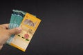 Hand holding Malaysia Ringgit MYR Currency Bank Notes. Royalty Free Stock Photo