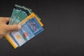 Hand holding Malaysia Ringgit MYR Currency Bank Notes. Royalty Free Stock Photo