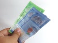 Hand holding 7 Malaysian ringgit banknotes Royalty Free Stock Photo