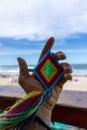 Hand Holding Mandala Eye of God Mexican Huichol Crafts Royalty Free Stock Photo