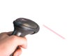 Hand holding manual scanner barcode machine with flat laser on b Royalty Free Stock Photo