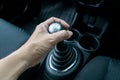 Hand holding manual transmission Royalty Free Stock Photo