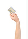 Hand holding medical drugs - full silver leaflet Royalty Free Stock Photo