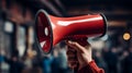 Hand holding megaphone on background, copy space