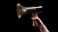 Hand holding megaphone on dark background. Al generated