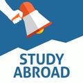 Hand Holding Megaphone With STUDY ABROAD Announcement