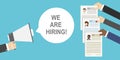 Hand holding megaphone and speech bubble with we are hiring text