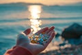 Hand holding micro plastics which was washed ashore from sea. Volunteer collects plastic from beach sand. Environment Royalty Free Stock Photo