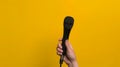 Hand Holding a Microphone.AI generated image Royalty Free Stock Photo