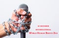 Hand holding microphone and have chain on fist hand with 10 december international world HUMAN RIGHTS DAY text Royalty Free Stock Photo