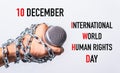 Hand holding microphone and have chain on fist hand with 10 december international world HUMAN RIGHTS DAY text Royalty Free Stock Photo