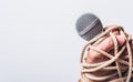 Hand holding microphone and have roped on fist hand Royalty Free Stock Photo