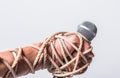 Hand holding microphone and have roped on fist hand Royalty Free Stock Photo